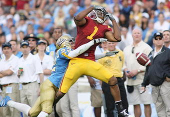 PASADENA, CA - DECEMBER 6:  Patrick Turner #1 of the USC Trojans is unable to catch the ball against Michael Norris #22 of the UCLA Bruins on December 6, 2008 at the Rose Bowl in Pasadena, California.  USC won 28-7.  (Photo by Jeff Golden/Getty Images)