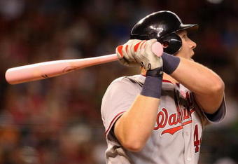 PHOENIX - MAY 10:  Adam Dunn #44 of the Washington Nationals hits a solo home run against the Arizona Diamondbacks during the third inning of the major league baseball game at Chase Field on May 10, 2009 in Phoenix, Arizona.  (Photo by Christian Petersen/Getty Images)