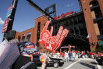 ST. LOUIS - APRIL 1:  A vendor sells foam fingers and pennants outside Busch Stadium before the St. Louis Cardinals game against the New York Mets during their Opening Day game on April 1, 2007 at Busch Stadium in St. Louis, Missouri.  The Mets beat the Cards 6-1.  (Photo by Dilip Vishwanat/Getty Images)