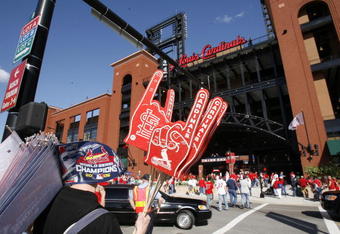 ST. LOUIS - APRIL 1:  A vendor sells foam fingers and pennants outside Busch Stadium before the St. Louis Cardinals game against the New York Mets during their Opening Day game on April 1, 2007 at Busch Stadium in St. Louis, Missouri.  The Mets beat the Cards 6-1.  (Photo by Dilip Vishwanat/Getty Images)