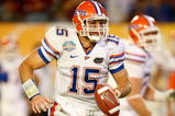 MIAMI - JANUARY 08:  Tim Tebow #15 of the Florida Gators rolls out of the pocker to throw a 20-yard touchdown pass to Louis Murphy #9 in the second quarter against the Oklahoma Sooners during the FedEx BCS National Championship game at Dolphin Stadium on January 8, 2009 in Miami, Florida.  (Photo by Marc Serota/Getty Images)