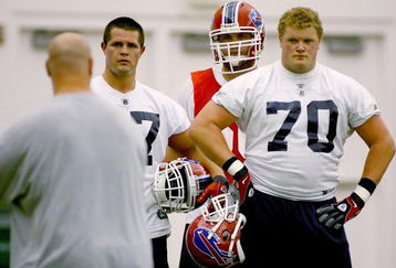ORCHARD PARK, NY - MAY 01: Andy Levitre #67 and Eric Wood #70 of the Buffalo Bills listen to lineman coach Sean Kugler during Buffalo Bills Minicamp at Buffalo Bills Fieldhouse on May 1, 2009 in Orchard Park, New York.  (Photo by Rick Stewart/Getty Images)