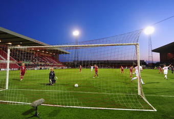 SWINDON, ENGLAND - JULY 22:  Jody Hanley (14 right) of England wheels away after scoring the only goal of the game during a Women's International friendly match between England and Denmark on July 22, 2009 in Swindon, England.  (Photo by Mike Hewitt/Getty Images)