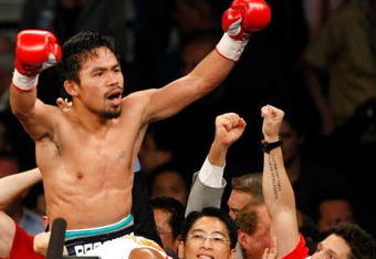 LAS VEGAS - MAY 02:  Manny Pacquiao of the Philippines celebrates after knocking out Ricky Hatton of England in the second round of their junior welterweight title fight at the MGM Grand Garden Arena May 2, 2009 in Las Vegas, Nevada.  (Photo by Ethan Miller/Getty Images)