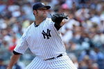 NEW YORK - JULY 19:  Joba Chamberlain #62 of the New York Yankees pitches against the Detroit Tigers on July 19, 2009 at Yankee Stadium in the Bronx borough of New York City.  (Photo by Jim McIsaac/Getty Images)