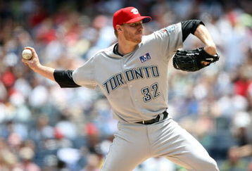 NEW YORK - JULY 04:  Roy Halladay #32 of the Toronto Blue Jays pitches against the New York Yankees on July 4, 2009 at Yankee Stadium in the Bronx borough of New York City.  (Photo by Nick Laham/Getty Images)