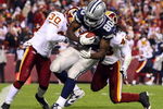 LANDOVER, MD - NOVEMBER 16: Martellus Bennett #80 of the Dallas Cowboys scores a touchdown in the fourth quarter against LaRon Landry #30 of the Washington Redskins during the game on November 16, 2008 at FedEx Field in Landover, Maryland. (Photo by Jim McIsaac/Getty Images) 
