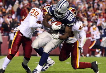 LANDOVER, MD - NOVEMBER 16: Martellus Bennett #80 of the Dallas Cowboys scores a touchdown in the fourth quarter against LaRon Landry #30 of the Washington Redskins during the game on November 16, 2008 at FedEx Field in Landover, Maryland. (Photo by Jim McIsaac/Getty Images) 
