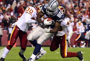 LANDOVER, MD - NOVEMBER 16: Martellus Bennett #80 of the Dallas Cowboys scores a touchdown in the fourth quarter against LaRon Landry #30 of the Washington Redskins during the game on November 16, 2008 at FedEx Field in Landover, Maryland. (Photo by Jim McIsaac/Getty Images) 
