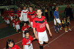 KUALA LUMPUR, MALAYSIA - JULY 20: Manchester United and Malaysia XI march into the pitch before kick off during the pre-season friendly match between Manchester United and Malaysia XI at Bukit Jalil National Stadium on July 20, 2009 in Kuala Lumpur, Malaysia. (Photo by Stanley Chou/Getty Images)