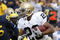 ANN ARBOR, MI - SEPTEMBER 15:  Golden Tate #23 of the Notre Dame Fighting Irish tries to turn the corner in front of Brandon Graham #55 of Michigan Wolverines at Michigan Stadium September 15, 2007 in Ann Arbor, Michigan. Michigan won the game 38-0.  (Photo by Gregory Shamus/Getty Images)