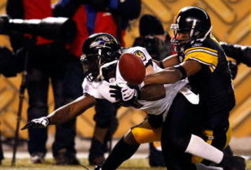 PITTSBURGH - JANUARY 18:  Limas Sweed #14 of the Pittsburgh Steelers breaks up a potential interception in the endzone  by Frank Walker #41 of the Baltimore Ravens during the AFC Championship game on January 18, 2009 at Heinz Field in Pittsburgh, Pennsylvania.  (Photo by Streeter Lecka/Getty Images)