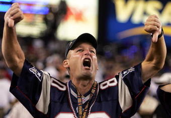 FOXBORO, MA - SEPTEMBER 8:  A fan of the New England Patriots boos the Oakland Raiders before their 2005 NFL opening game at Gillette Stadium on September 8, 2005 in Foxboro, Massachusetts.  (Photo by Nick Laham/Getty Images)
