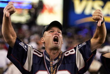 FOXBORO, MA - SEPTEMBER 8:  A fan of the New England Patriots boos the Oakland Raiders before their 2005 NFL opening game at Gillette Stadium on September 8, 2005 in Foxboro, Massachusetts.  (Photo by Nick Laham/Getty Images)