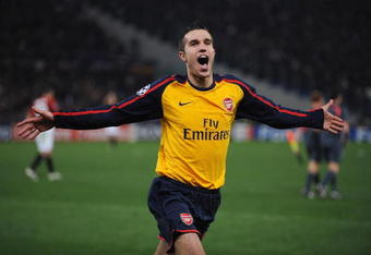 ROME - MARCH 11:  Robin van Persie of Arsenal celebrates victory after winning on penalties during the UEFA Champions League, Round of Last 16, Second Leg match between AS Roma and Arsenal at the Stadio Olimpico on March 11, 2009 in Rome, Italy.  (Photo by Shaun Botterill/Getty Images)