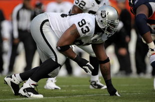 DENVER - NOVEMBER 23:  Defensive tackle Tommy Kelly #93 of the Oakland Raiders defends against the Denver Broncos during week 12 NFL action at Invesco Field at Mile High on November 23, 2008 in Denver, Colorado. The Raiders defeated the Broncos 31-10.  (Photo by Doug Pensinger/Getty Images)