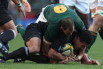 CAPE TOWN, SOUTH AFRICA - AUGUST 16:  Mils Muliaina of New Zealand is held by Fourie du Preez during the 2008 Tri Nations match between the South Africa Springboks and the New Zealand All Blacks at Newlands on August 16, 2008 in Cape Town, South Africa.  (Photo by David Rogers/Getty Images)
