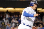 LOS ANGELES, CA - APRIL 16:  Doug Mientkiewicz #26 of the Los Angeles Dodgers on his way to second base on a double to score two runs against the San Francisco Giants during the sixth inning at Dodger Stadium on April 16, 2009 in Los Angeles, California.  (Photo by Harry How/Getty Images)