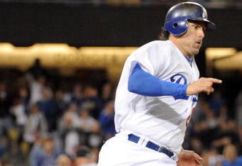 LOS ANGELES, CA - APRIL 16:  Doug Mientkiewicz #26 of the Los Angeles Dodgers on his way to second base on a double to score two runs against the San Francisco Giants during the sixth inning at Dodger Stadium on April 16, 2009 in Los Angeles, California.  (Photo by Harry How/Getty Images)