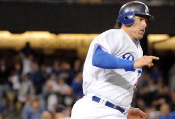 LOS ANGELES, CA - APRIL 16:  Doug Mientkiewicz #26 of the Los Angeles Dodgers on his way to second base on a double to score two runs against the San Francisco Giants during the sixth inning at Dodger Stadium on April 16, 2009 in Los Angeles, California.  (Photo by Harry How/Getty Images)