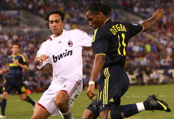 BALTIMORE - JULY 24: Didier Drogba #11 of Chelsea FC passes against Alessandro Nesta #13 of AC Milan at M & T Bank Stadium on July 24, 2009 in Baltimore, Maryland. (Photo by Ned Dishman/Getty Images)