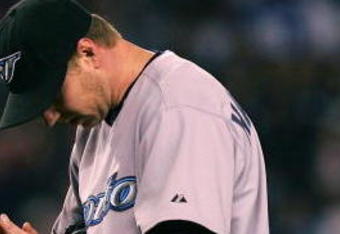 NEW YORK - SEPTEMBER 21:  Roy Halladay #32 of the Toronto Blue Jays reacts against the New York Yankees at Yankee Stadium on September 21, 2007 in the Bronx borough of New York City.  (Photo by Chris McGrath/Getty Images)
