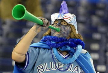TORONTO - APRIL 6:  A fan of the Toronto Blue Jays cheers during batting practice as the Toronto Blue Jays  prepare to face the Detroit Tigers during their MLB opening day game at the Rogers Centre April 6, 2009 in Toronto, Ontario.(Photo By Dave Sandford/Getty Images)