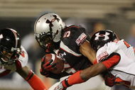 ORLANDO, FL - JANUARY 04:  Running back Jaamal Berry #5 of the black team is brought down before fumbling in the All America Under Armour Football Game at Florida Citrus Bowl on January 4, 2009 in Orlando, Florida.  (Photo by Doug Benc/Getty Images)