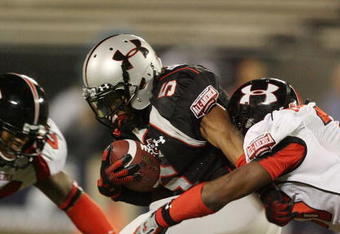 ORLANDO, FL - JANUARY 04:  Running back Jaamal Berry #5 of the black team is brought down before fumbling in the All America Under Armour Football Game at Florida Citrus Bowl on January 4, 2009 in Orlando, Florida.  (Photo by Doug Benc/Getty Images)