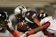 ORLANDO, FL - JANUARY 04:  Running back Jaamal Berry #5 of the black team is brought down before fumbling in the All America Under Armour Football Game at Florida Citrus Bowl on January 4, 2009 in Orlando, Florida.  (Photo by Doug Benc/Getty Images)