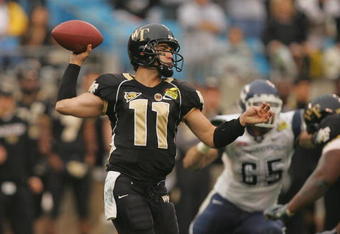 CHARLOTTE, NC - DECEMBER 29:  Riley Skinner #11 of the Wake Forest Demon Deacons throws a pass against the Connecticut Huskies during their game at Bank of America Stadium on December 29, 2007 in Charlotte, North Carolina. (Photo by Streeter Lecka/Getty Images)