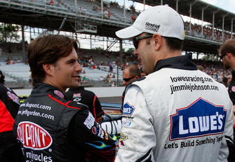 INDIANAPOLIS - JULY 25:  Jeff Gordon, driver of the #24 DuPont Chevrolet talks with Jimmie Johnson, driver of the #48 Lowe's Chevrolet during qualifying for the NASCAR Sprint Cup Series Allstate 400 at the Brickyard at Indianapolis Motor Speedway on July 25, 2009 in Indianapolis, Indiana.  (Photo by Chris Graythen/Getty Images)