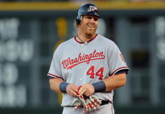 DENVER - JULY 06:  Adam Dunn #44 of the Washington Nationals doubles against the Colorado Rockies during MLB action at Coors Field on July 6, 2009 in Denver, Colorado. The Rockies defeated the Nationals 1-0.  (Photo by Doug Pensinger/Getty Images)