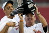 TAMPA, FL - DECEMBER 06:  Defensive end Orion Martin #90 and head coach Frank Beamer of the Virginia Tech Hokies holds up the ACC trophy after defeating the Boston College Eagles in the 2008 ACC Football Championship game at the Raymond James Stadium on December 6, 2008 in Tampa, Florida. Virginia Tech defeated Boston College 30-12.  (Photo by Doug Benc/Getty Images)