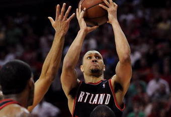 HOUSTON - APRIL 26:  Guard Brandon Roy #7 of the Portland Trail Blazers goes up for a shot where he is called for an offensive foul against Chuck Hayes #44 of the Houston Rockets in the last minute of play in Game Four of the Western Conference Quarterfinals during the 2009 NBA Playoffs at Toyota Center on April 26, 2009 in Houston, Texas. NOTE TO USER: User expressly acknowledges and agrees that, by downloading and or using this photograph, User is consenting to the terms and conditions of the Getty Images License Agreement.  (Photo by Ronald Martinez/Getty Images)