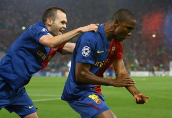 ROME - MAY 27:  Samuel Eto'o of Barcelona and his team mate Andres Iniesta celebrate after Eto'o scored the first goal for Barcelona during the UEFA Champions League Final match between Manchester United and Barcelona at the Stadio Olimpico on May 27, 2009 in Rome, Italy.  (Photo by Alex Livesey/Getty Images)