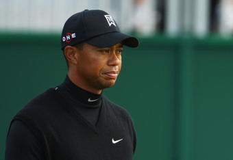 TURNBERRY, SCOTLAND - JULY 17:  Tiger Woods of USA leaves the 18th green during round two of the 138th Open Championship on the Ailsa Course, Turnberry Golf Club on July 17, 2009 in Turnberry, Scotland.  (Photo by Richard Heathcote/Getty Images)