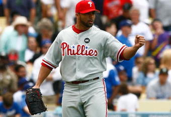 LOS ANGELES, CA - JUNE 06:  Relief pitcher J.C. Romero #16 of the Philadelphia Phillies pumps his fist after getting Orlando Hudson of the Los Angeles Dodgers to pop out in the seventh inning at Dodger Stadium on June 6, 2009 in Los Angeles, California. The Dodgers defeated the Phillies 3-2 in twelve innings.  (Photo by Jeff Gross/Getty Images)