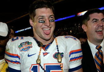 MIAMI - JANUARY 08:  Quarterback Tim Tebow #15 of the Florida Gators celebrates after defeating the Oklahoma Sooners in the FedEx BCS National Championship Game at Dolphin Stadium on January 8, 2009 in Miami, Florida. The Gators won the game by a score of 24-14.  (Photo by Eliot J. Schechter/Getty Images)