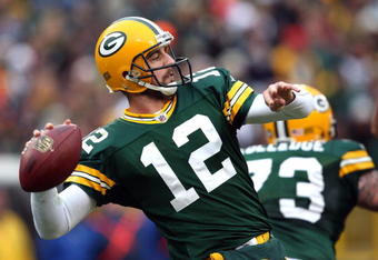GREEN BAY, WI - NOVEMBER 30:  Aaron Rodgers #12 of the Green Bay Packers throws a pass against the Carolina Panthers at Lambeau Field on November 30, 2008 in Green Bay, Wisconsin.  (Photo by Jonathan Daniel/Getty Images)