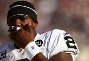 BALTIMORE - OCTOBER 26:  JaMarcus Russell #2 of the Oakland Raiders looks on from the bench against  the Baltimore Ravens during the game at M&T Bank Stadium October 26, 2008 in Baltimore, Maryland.  (Photo by Chris McGrath/Getty Images)