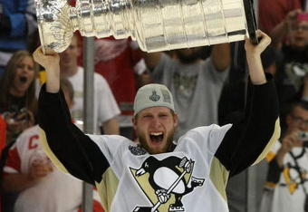 DETROIT - JUNE 12: Jordan Staal #11 of the Pittsburgh Penguins celebrates with the Stanley Cup following the Penguins victory over the Detroit Red Wings in Game Seven of the 2009 NHL Stanley Cup Finals at Joe Louis Arena on June 12, 2009 in Detroit, Michigan. (Photo by Bruce Bennett/Getty Images)