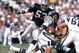 LOS ANGELES - SEPTEMBER 28: Running back Lionel James #26 of the San Diego Chargers rushes for yards as linebacker Rod Martin #53 of the Los Angeles Raiders applies pressure during a game at the Los Angeles Memorial Coliseum on September 28, 1986 in Los Angeles, California. The Raiders won 17-13. (Photo by George Rose/Getty Images)