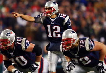 FOXBORO, MA - NOVEMBER 25:  Tom Brady #12 of the New England Patriots calls a play at the line against the Philadelphia Eagles at Gillette Stadium on November 25, 2007 in Foxboro, Massachusetts.  (Photo by Elsa/Getty Images)