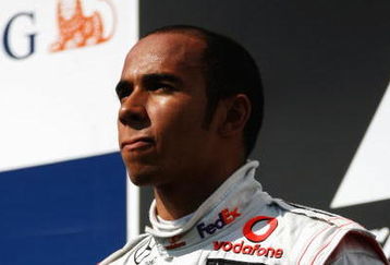 BUDAPEST, HUNGARY - JULY 26:  Lewis Hamilton of Great Britain and McLaren Mercedes celebrates on the podium after winning the Hungarian Formula One Grand Prix at the Hungaroring on July 26, 2009 in Budapest, Hungary.  (Photo by Paul Gilham/Getty Images)