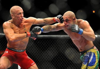 LAS VEGAS - JULY 11:  (L-R) Georges St. Pierre battles Thiago Alves during their welterweight title bout during UFC 100 on July 11, 2009 in Las Vegas, Nevada.  (Photo by Jon Kopaloff/Getty Images)