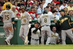 BOSTON - JULY 06:  Ryan Sweeney #15 and Kurt Suzuki #8 of the Oakland Athletics are congratulated after they scored against the Boston Red Sox on July 6, 2009 at Fenway Park in Boston, Massachusetts. The Athletics defeated the Red Sox 6-0. (Photo by Elsa/Getty Images)