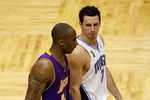 ORLANDO, FL - JUNE 14:  Kobe Bryant #24 of the Los Angeles Lakers and J.J. Redick #7 of the Orlando Magic walk up court in Game Five of the 2009 NBA Finals on June 14, 2009 at Amway Arena in Orlando, Florida.  The Lakers won 99-86.  NOTE TO USER:  User expressly acknowledges and agrees that, by downloading and or using this photograph, User is consenting to the terms and conditions of the Getty Images License Agreement.  (Photo by Chris Graythen/Getty Images)