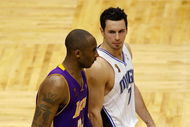 ORLANDO, FL - JUNE 14:  Kobe Bryant #24 of the Los Angeles Lakers and J.J. Redick #7 of the Orlando Magic walk up court in Game Five of the 2009 NBA Finals on June 14, 2009 at Amway Arena in Orlando, Florida.  The Lakers won 99-86.  NOTE TO USER:  User expressly acknowledges and agrees that, by downloading and or using this photograph, User is consenting to the terms and conditions of the Getty Images License Agreement.  (Photo by Chris Graythen/Getty Images)