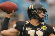 CHARLOTTE, NC - DECEMBER 29:  Riley Skinner #11 of the Wake Forest Demon Deacons throws a pass against the Connecticut Huskies during their game at Bank of America Stadium on December 29, 2007 in Charlotte, North Carolina. (Photo by Streeter Lecka/Getty Images)